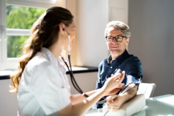 doctor taking blood pressure