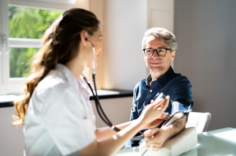 Recognising and managing health concerns in Cheshire 8 doctor taking blood pressure