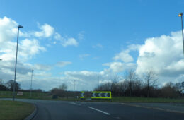 A road approaching a roundabout on the A500 at Shavington.