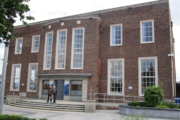 The brick frontage and entrance of Ellesmere Port Library.